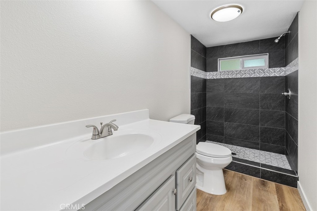 42580 East Benton Road Hemet, CA 92544 - Photo 23 of 31 a bathroom with a sink a toilet and shower