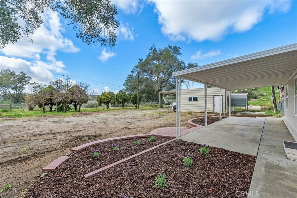 42580 East Benton Road Hemet, CA 92544 - Photo 28 of 31 a view of a house with a yard
