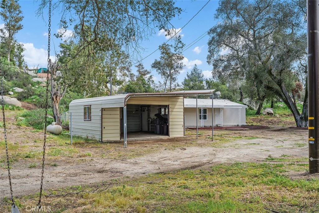 42580 East Benton Road Hemet, CA 92544 - Photo 30 of 31 a view of a house with a yard