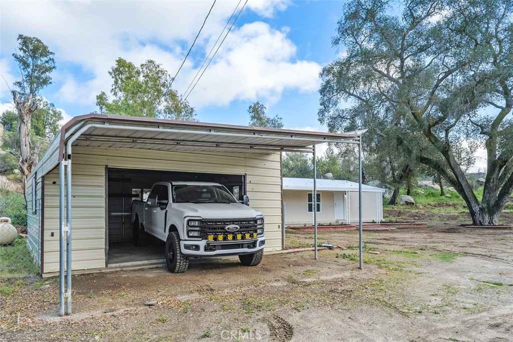 42580 East Benton Road Hemet, CA 92544 - Photo 7 of 31 a view of a house with a balcony and porch