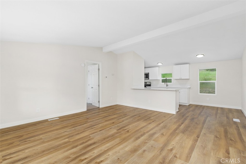 42580 East Benton Road Hemet, CA 92544 - Photo 8 of 31 a view of kitchen with wooden floor and kitchen