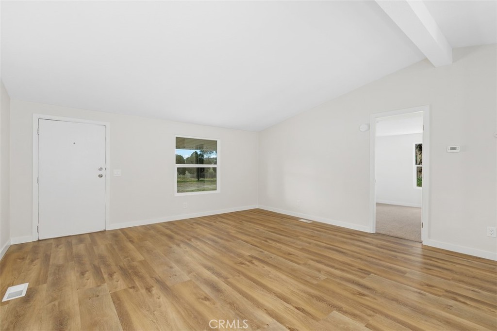 42580 East Benton Road Hemet, CA 92544 - Photo 9 of 31 a view of empty room with wooden floor