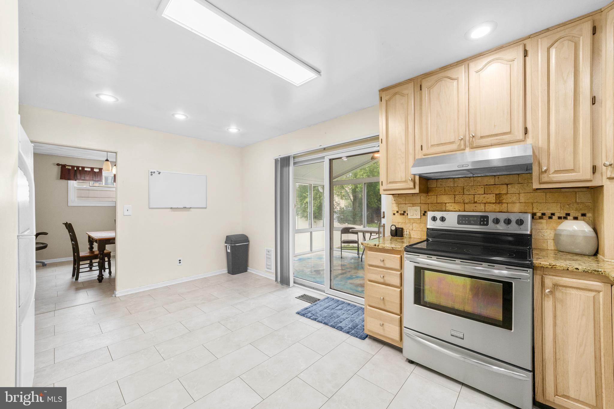 25 Clemson Road Cherry Hill, NJ 08034 - Photo 12 of 34 a kitchen with stainless steel appliances granite countertop a stove and a refrigerator