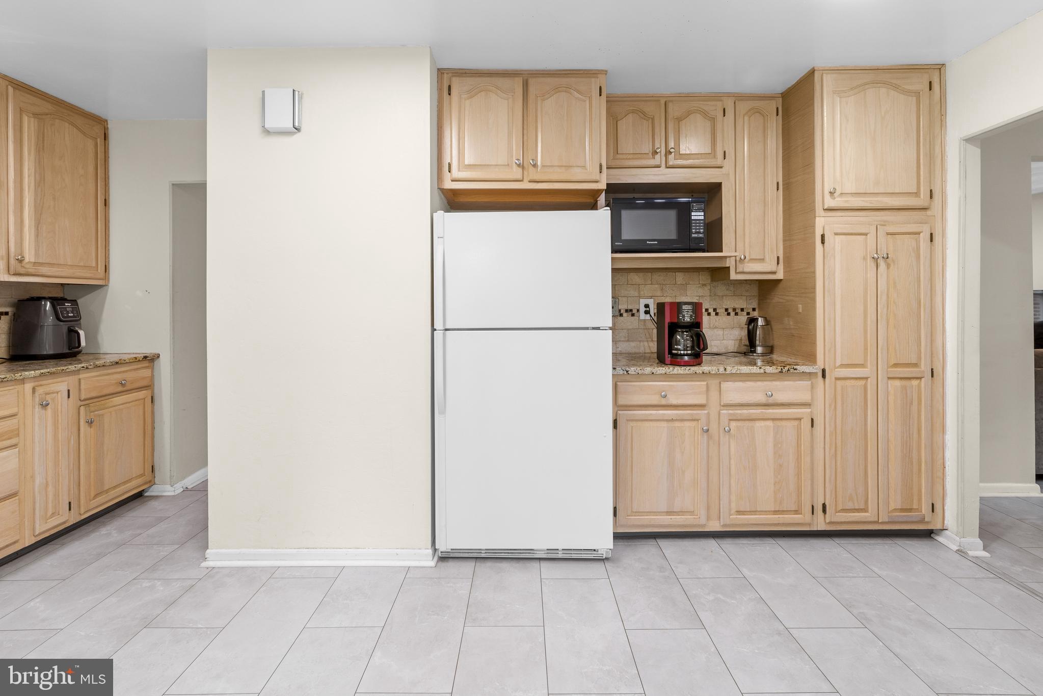 25 Clemson Road Cherry Hill, NJ 08034 - Photo 13 of 34 a kitchen with white cabinets and refrigerator