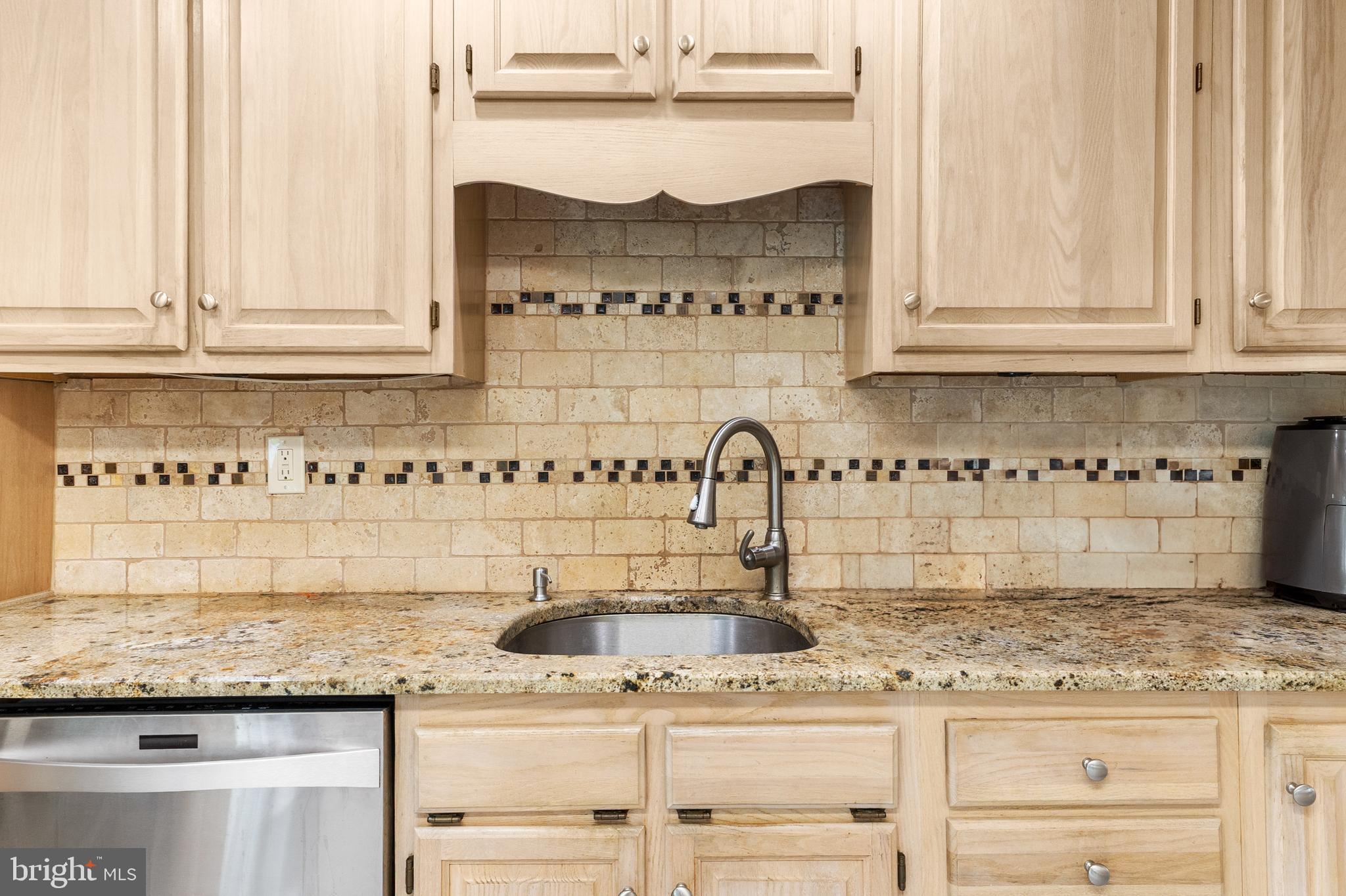 25 Clemson Road Cherry Hill, NJ 08034 - Photo 14 of 34 a kitchen with kitchen island granite countertop white cabinets and a sink