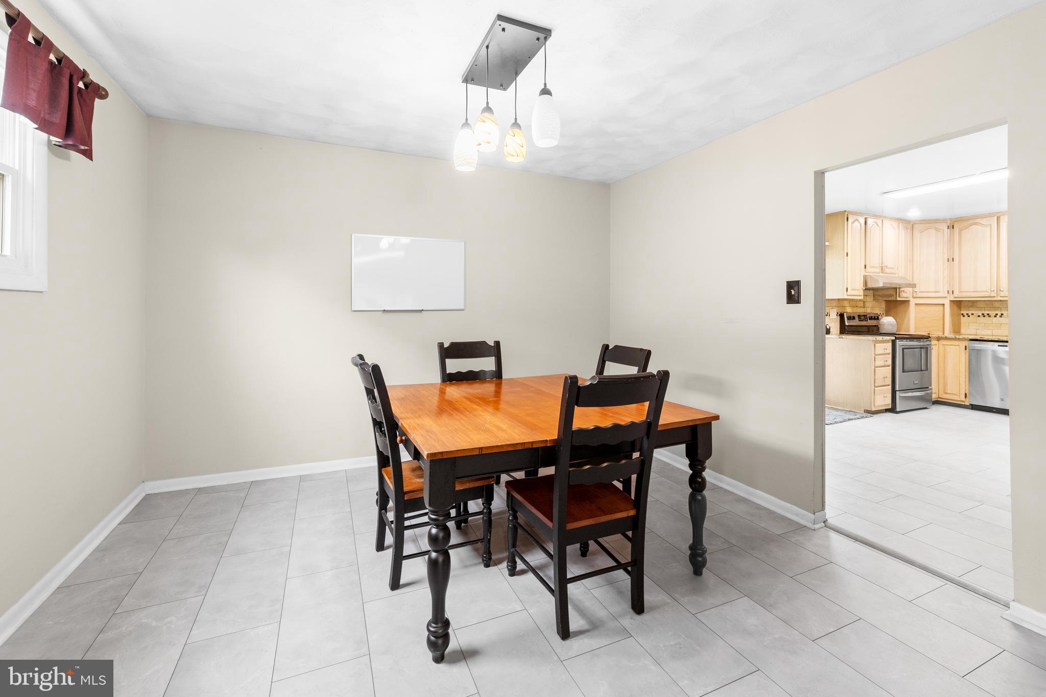 25 Clemson Road Cherry Hill, NJ 08034 - Photo 16 of 34 a view of a dining room with furniture and wooden floor