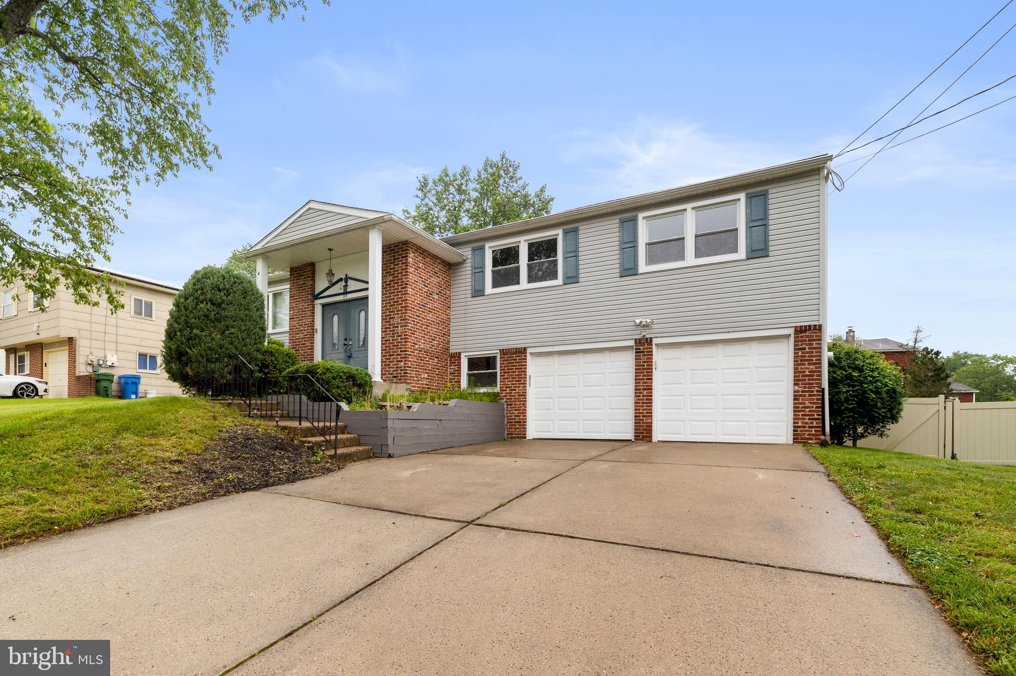 25 Clemson Road Cherry Hill, NJ 08034 - Photo 2 of 34 a front view of a house with a yard and garage