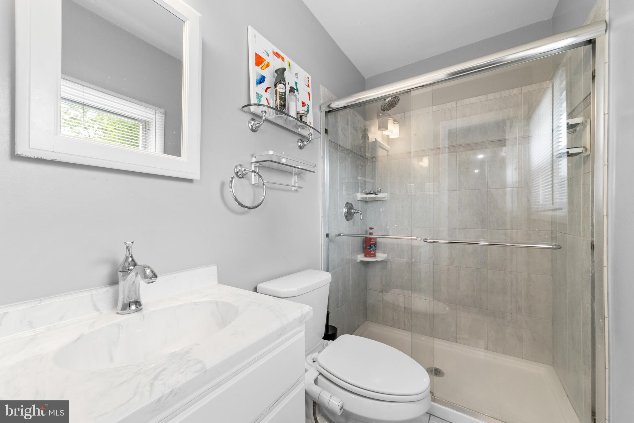 25 Clemson Road Cherry Hill, NJ 08034 - Photo 21 of 34 a bathroom with a sink a toilet and shower