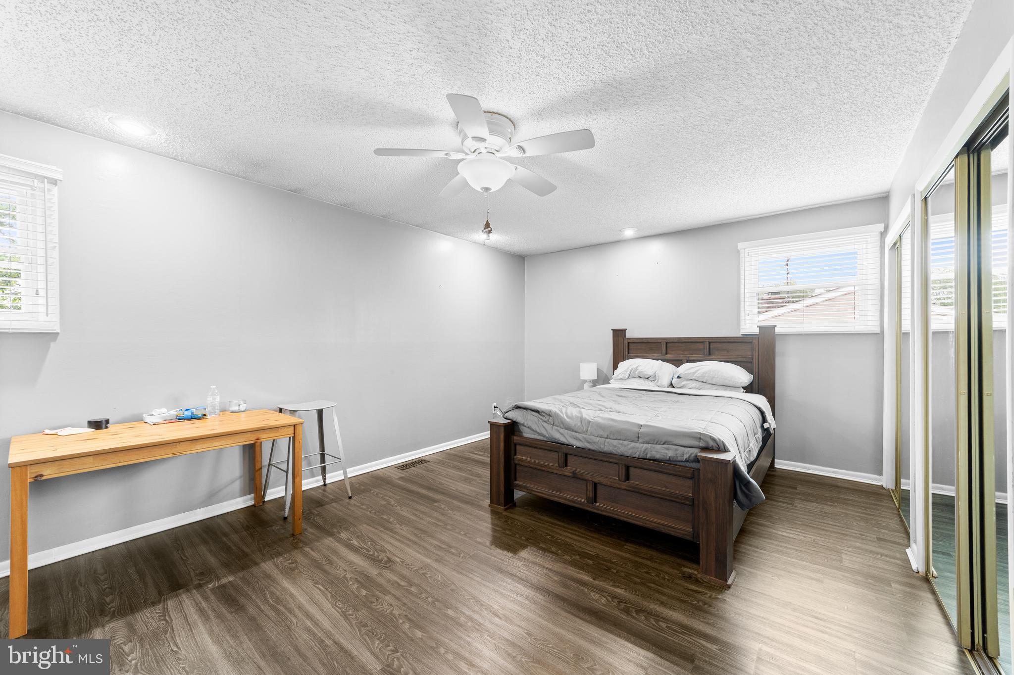 25 Clemson Road Cherry Hill, NJ 08034 - Photo 30 of 34 a bedroom with a bed and a chandelier