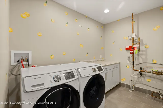 a utility room with dryer and washer