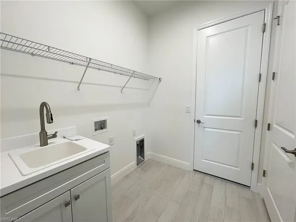 a view of a bathroom with a sink and mirror