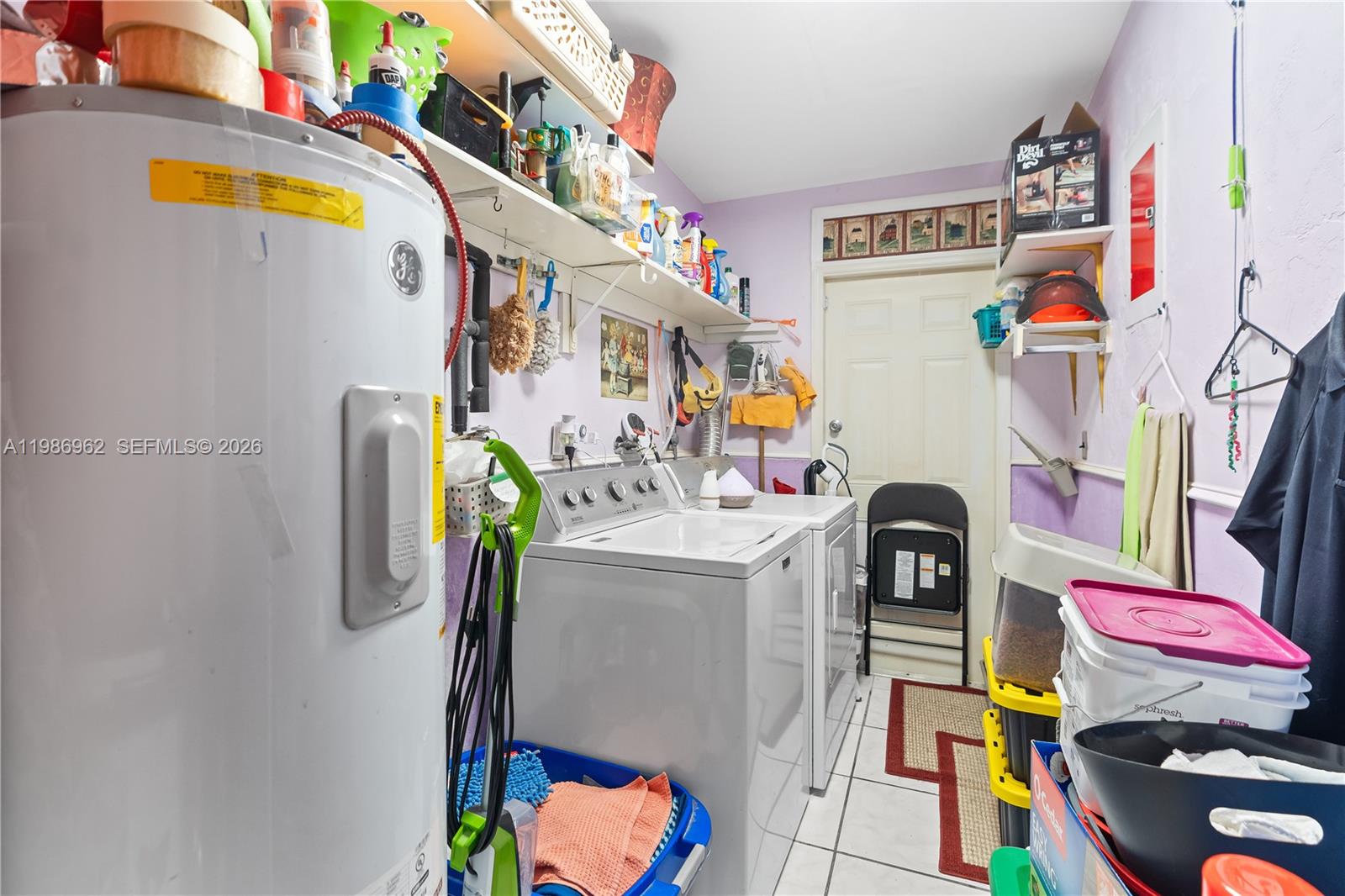 720 Northwest 4th Street Hallandale Beach, FL 33009 - Photo 17 of 27 a utility room with dryer and washer