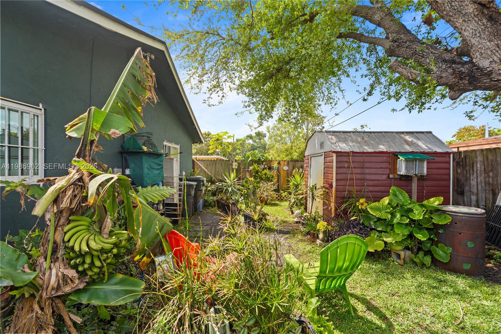 720 Northwest 4th Street Hallandale Beach, FL 33009 - Photo 7 of 27 a view of a flower in a yard
