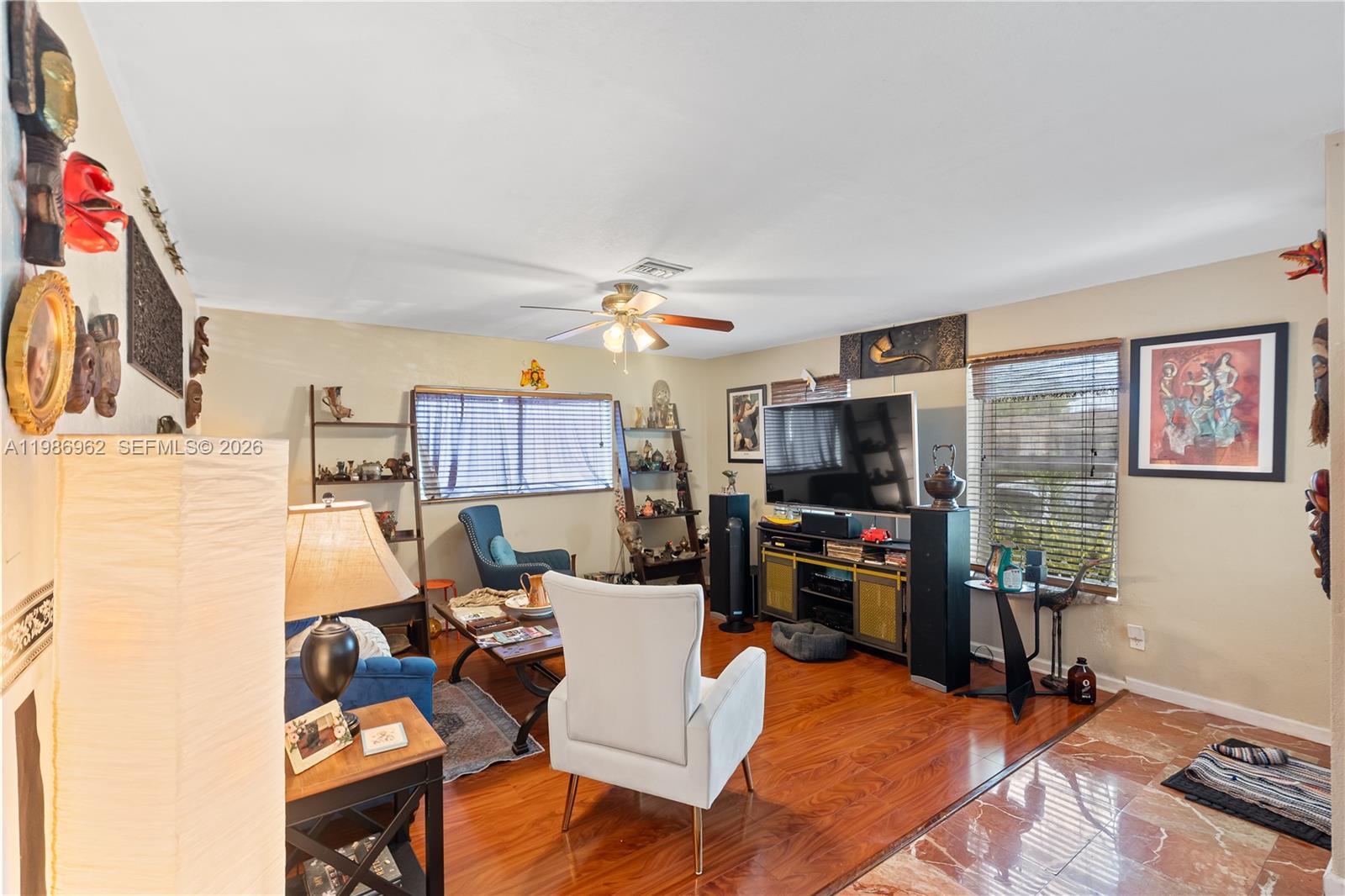 720 Northwest 4th Street Hallandale Beach, FL 33009 - Photo 10 of 27 a living room with furniture and a flat screen tv