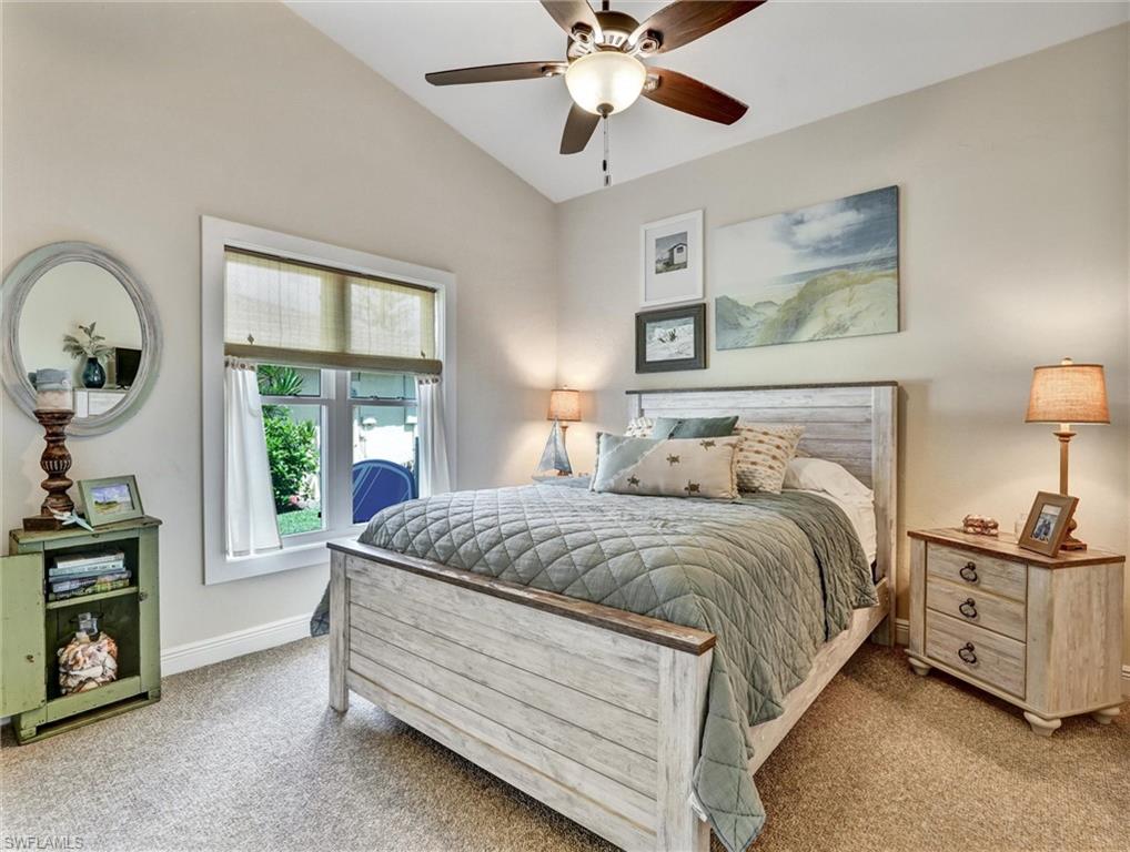 421 Countryside Drive Naples, FL 34104 - Photo 23 of 44 Second Bedroom with light carpet, lofted ceiling, and ceiling fan