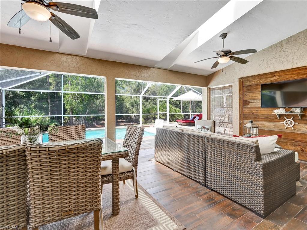 421 Countryside Drive Naples, FL 34104 - Photo 28 of 44 Sunroom with ceiling fan, outdoor lounge area, and a patio
