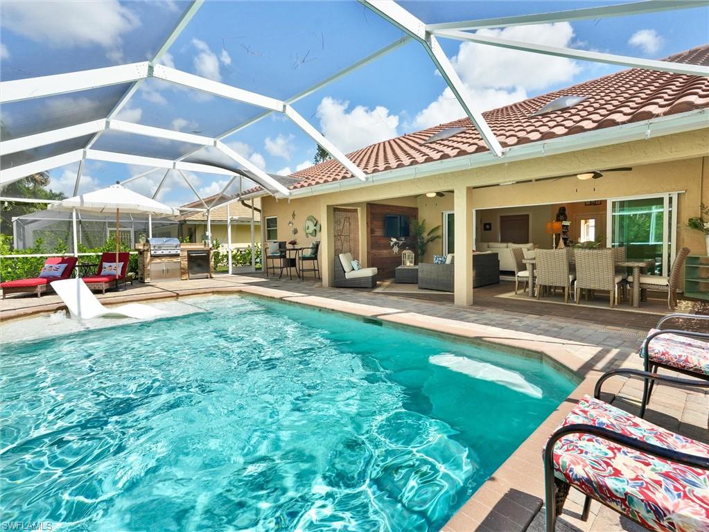 421 Countryside Drive Naples, FL 34104 - Photo 3 of 44 Outdoor pool featuring a patio, an outdoor hangout area, outdoor dining space, and a lanai