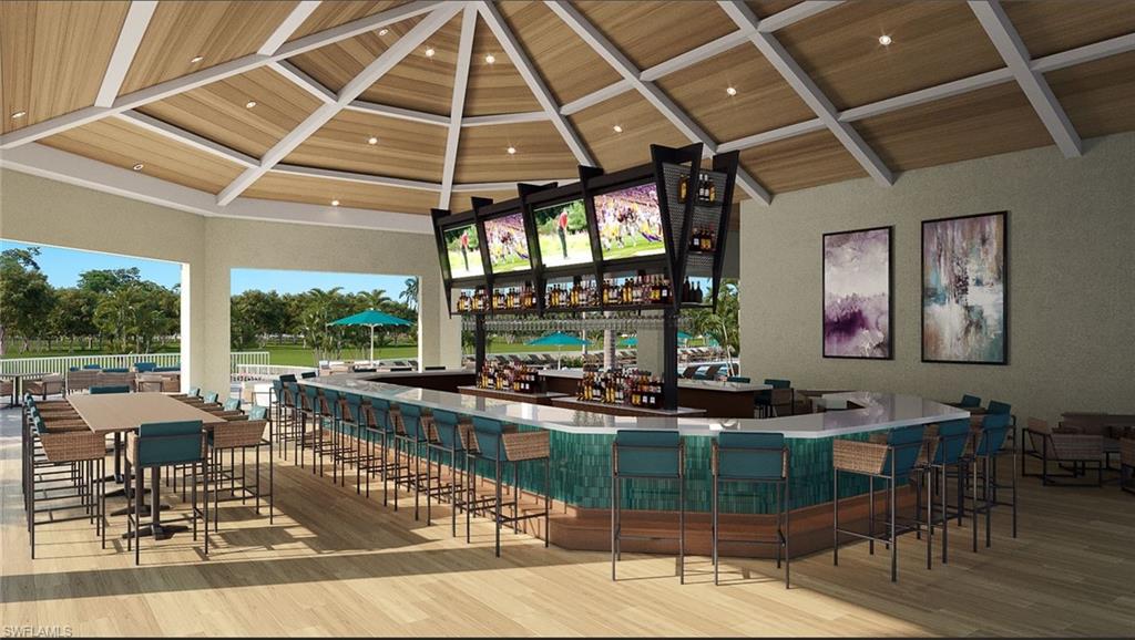 421 Countryside Drive Naples, FL 34104 - Photo 33 of 44 Community bar area with recessed lighting and healthy amount of natural light