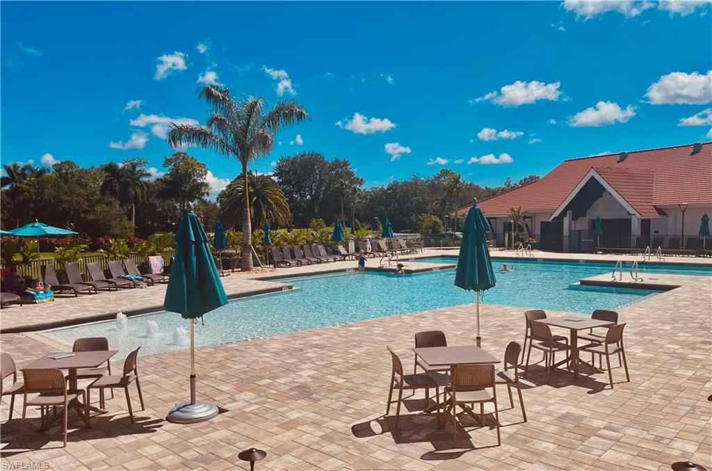 421 Countryside Drive Naples, FL 34104 - Photo 35 of 44 Community pool featuring a patio area