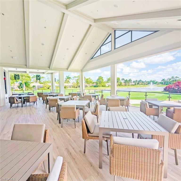 421 Countryside Drive Naples, FL 34104 - Photo 42 of 44 Outdoor casual dining space with view of golf course, and a water view