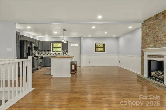 a view of kitchen with cabinets and wooden floor