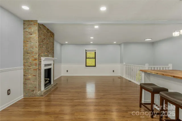a view of a kitchen with furniture and a fireplace