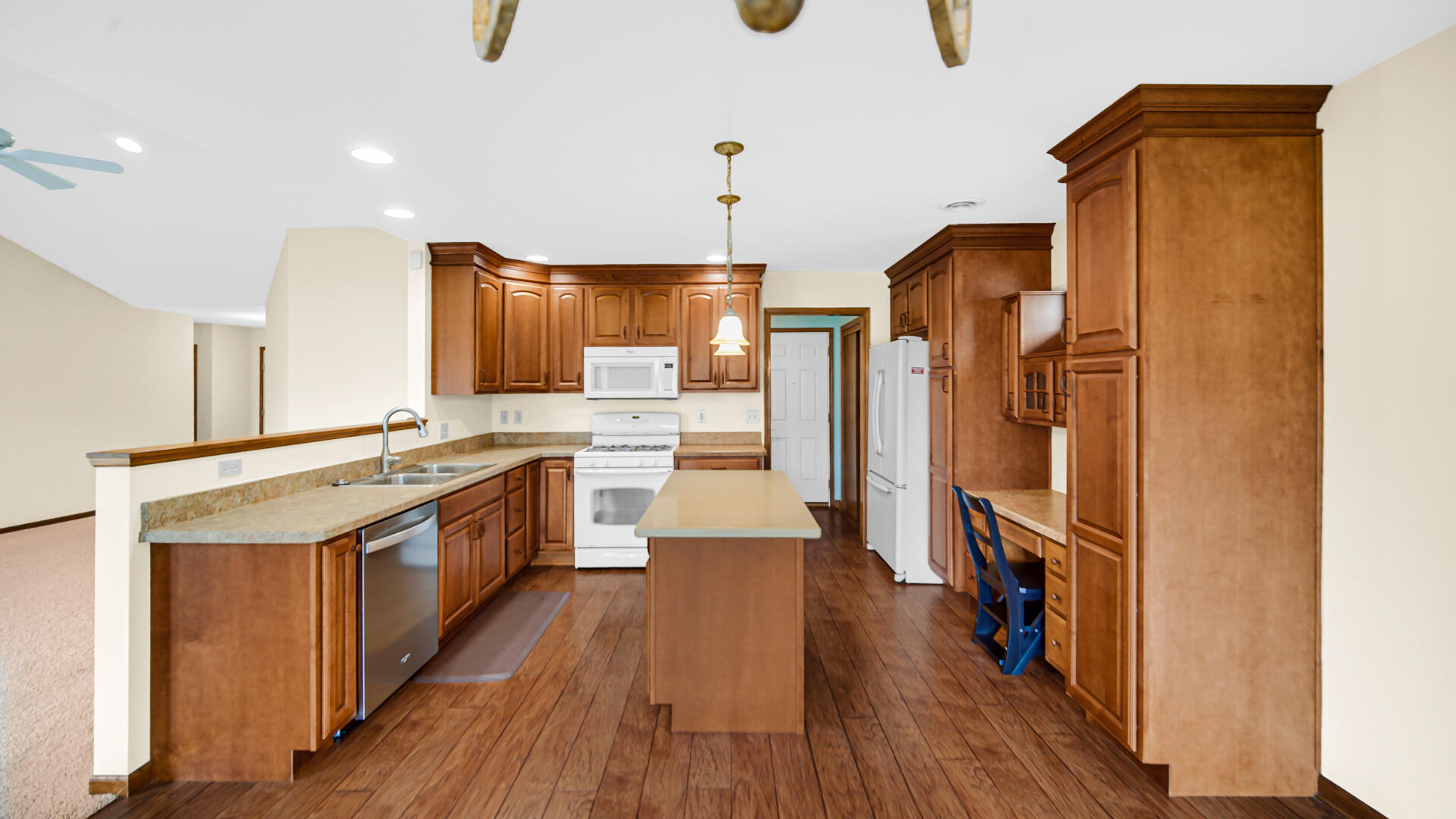 2635 43rd Street Highland, IN 46322 - Photo 6 of 24 a kitchen with stainless steel appliances granite countertop a refrigerator a sink dishwasher a stove and a wooden floor