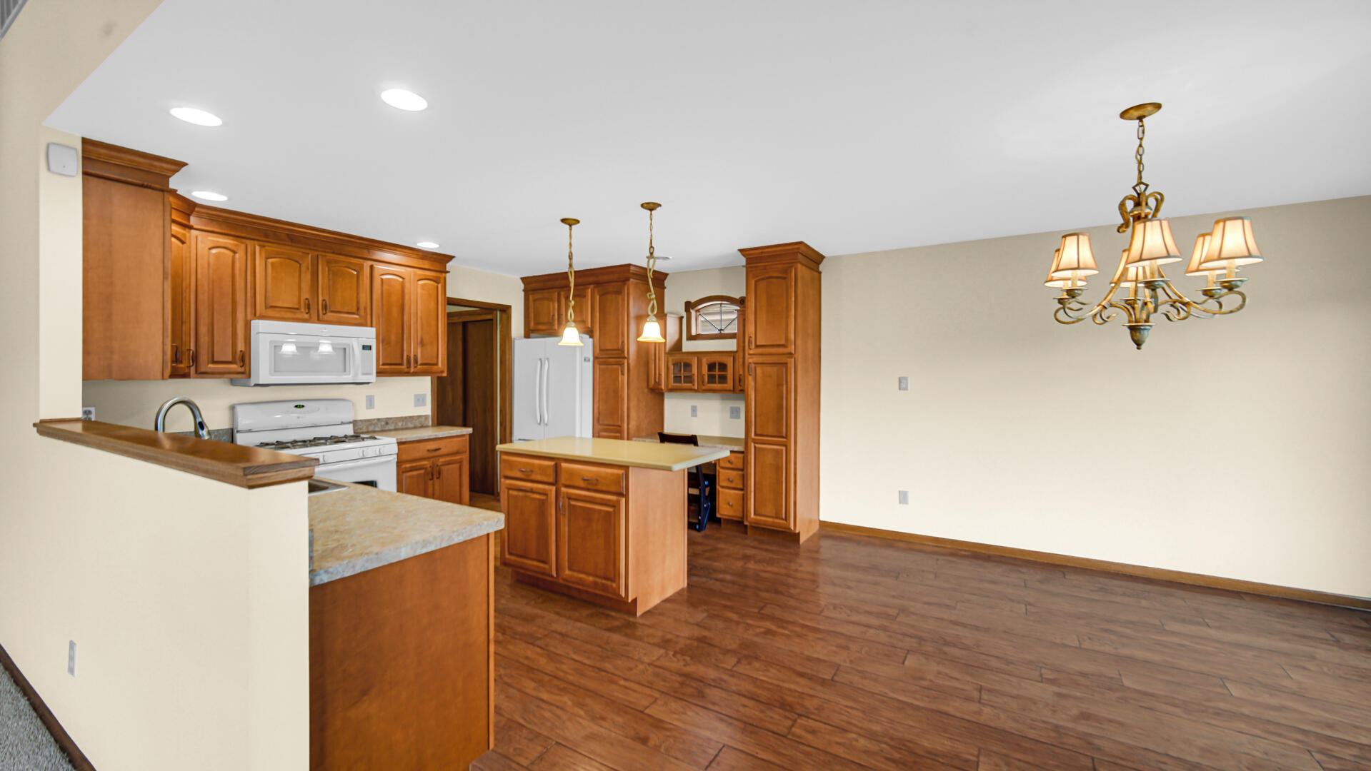 2635 43rd Street Highland, IN 46322 - Photo 8 of 24 a kitchen with stainless steel appliances a stove refrigerator and cabinets