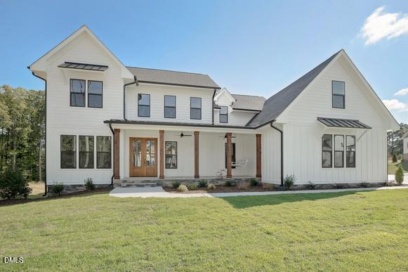 422 Lower Thrift Road New Hill, NC 27562 - Photo 1 of 14 a view of a house with yard and garage