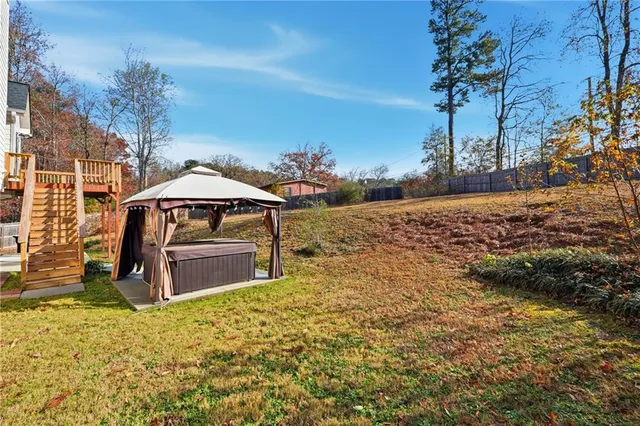 a view of a backyard of the house