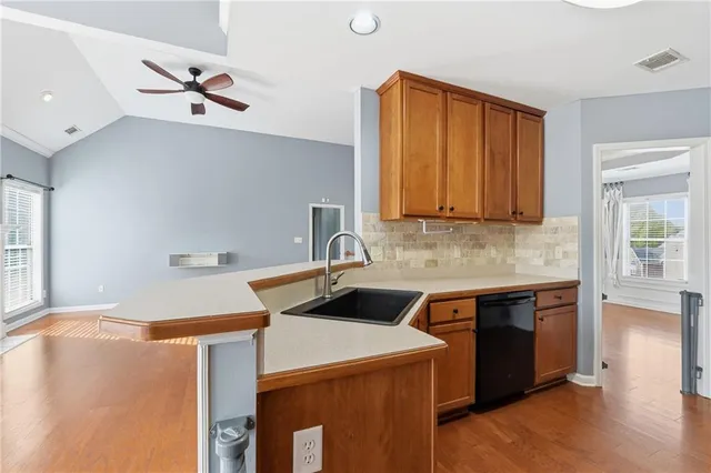 a kitchen that has a sink and a stove in it