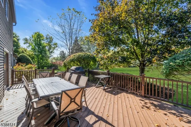 a view of a table and chairs on the roof deck