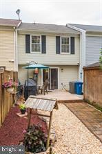 17 Devon Court Sterling, VA 20165 - Photo 27 of 30 a view of a house with backyard porch and sitting area