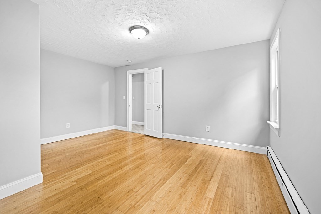 19 Forest Drive Auburn, MA 01501 - Photo 14 of 31 a view of an empty room with wooden floor
