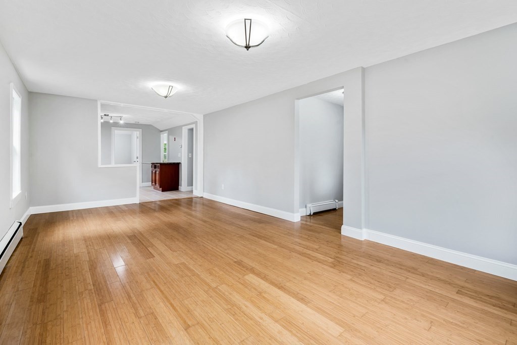 19 Forest Drive Auburn, MA 01501 - Photo 17 of 31 a view of empty room with wooden floor and fan