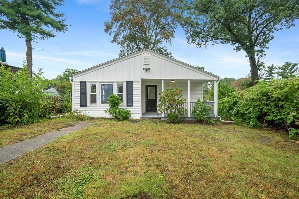 19 Forest Drive Auburn, MA 01501 - Photo 2 of 31 a front view of a house with a garden