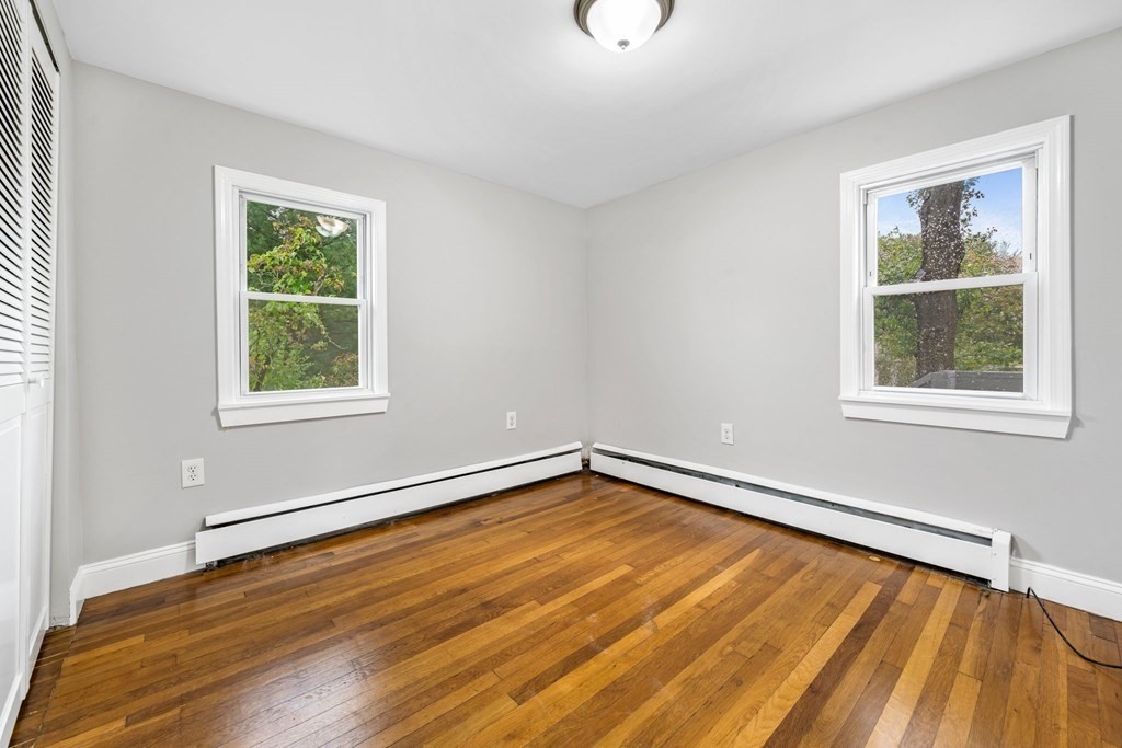 19 Forest Drive Auburn, MA 01501 - Photo 21 of 31 a view of an empty room with wooden floor and a window