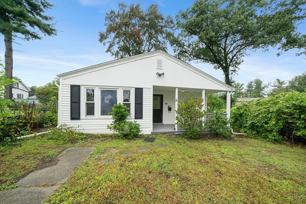 19 Forest Drive Auburn, MA 01501 - Photo 3 of 31 a front view of a house with garden