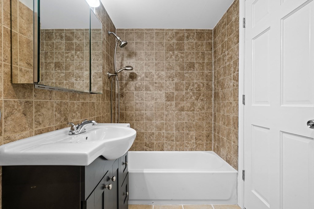 19 Forest Drive Auburn, MA 01501 - Photo 10 of 31 a bathroom with a sink and a bathtub