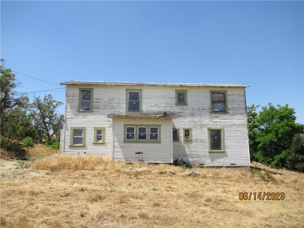 39600 Bautista Road Anza, CA 92539 - Photo 1 of 1 a front view of a house with a yard