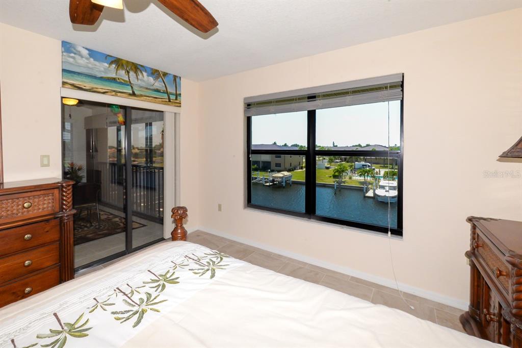 335 Coldeway Drive, Unit F21 Punta Gorda, FL 33950 - Photo 27 of 45 a bedroom with a bed and a dresser