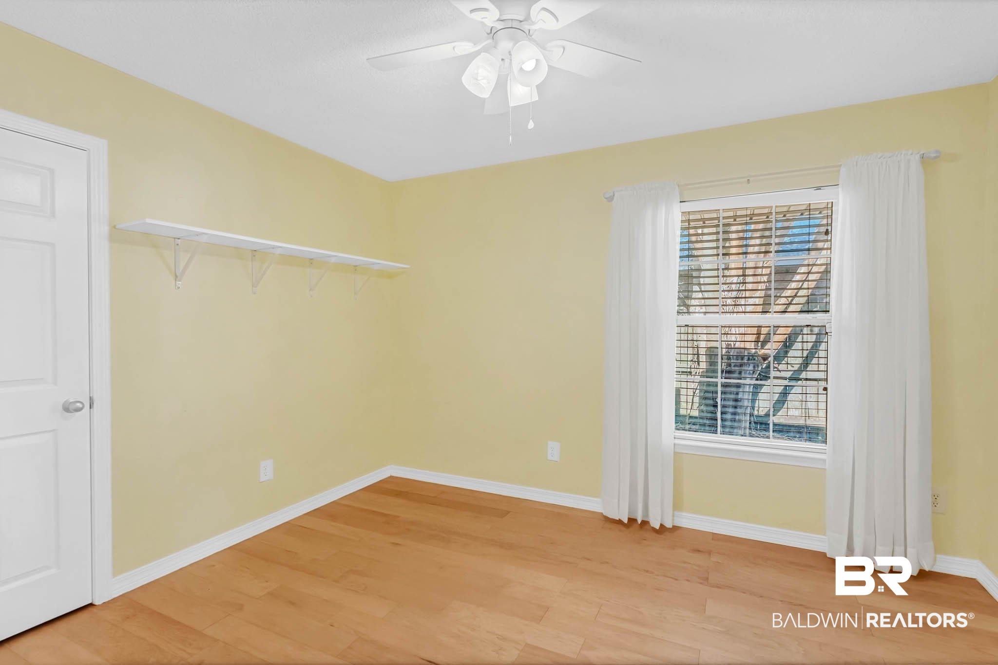 9607 Czar Court Fairhope, AL 36532 - Photo 25 of 42 Spare room with light wood-style flooring and a ceiling fan