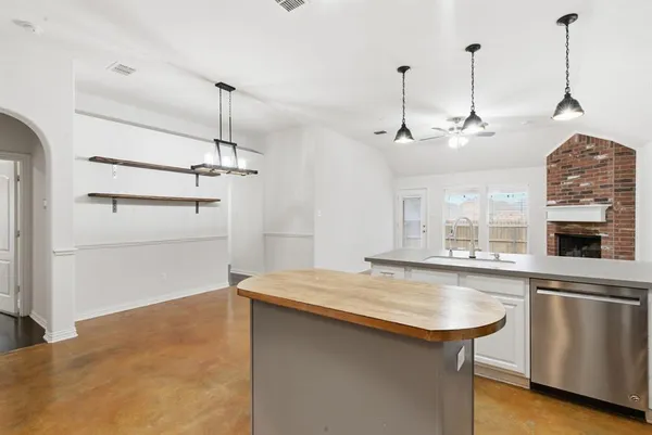 a view of a kitchen with a sink and dishwasher