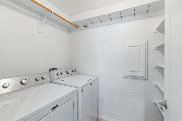 a bathroom with a bathtub shower sink vanity and a mirror