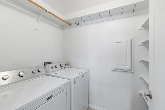a bathroom with a bathtub shower sink vanity and a mirror