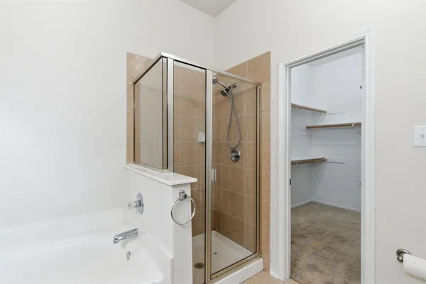 a bathroom with a double vanity sink and mirror