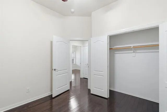 a view of a porch with furniture and garden