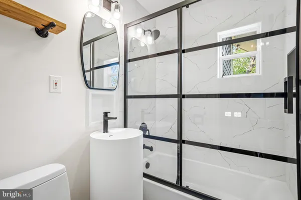 a bathroom with a sink and a shower