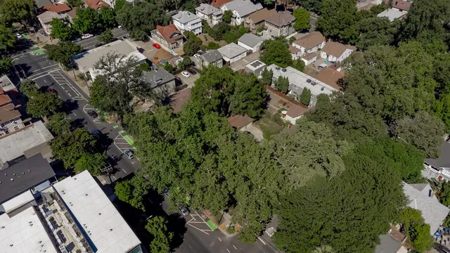 an aerial view of a building with trees