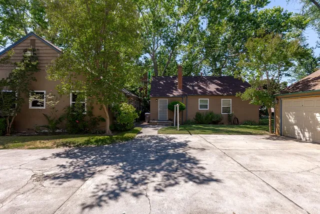 a backyard of a house with lots of green space